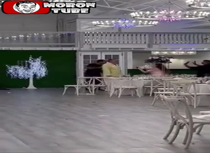 Video :Venue owner takes pictures of the bride and groom at a wedding in Florida